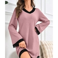Close-up of pink ribbed nightdress with intricate black lace trim on the V-neckline - Pink