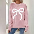 Pink long-sleeve knit sweater featuring a white bow pattern and contrast trim - S / Pink