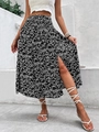 Detail of high-waist elastic waistband and side slit on floral midi skirt - S / Black