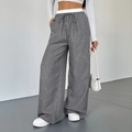 Pantaloni larghi casual da donna a vita alta con strisce verticali bianche e nere e coulisse - Taglia S / strisce nere