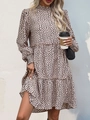Detail of high collar smocked neckline and long sleeve cuffs on leopard print tiered dress - Khaki