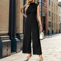 Detail of elegant black sleeveless jumpsuit with draped neckline and wide-leg cut on street - S / Black