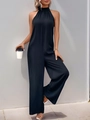 Macro shot of minimalist black halter neck jumpsuit featuring elegant pleated neckline details - S / Black