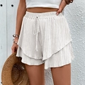 Beige high-waisted layered ruffle shorts with drawstring waist for casual beach wear - White