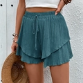 Women's dark blue tiered ruffle leisure shorts with textured fabric and drawstring waist - Teal Blue