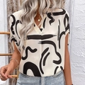 Blusa de mujer con cuello en V y manga murciélago con estampado geométrico negro en crema - S / Albaricoque