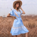 Summer V-neck floral blue dress with short sleeves and waist tie on a grassy field - S / Blue