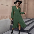 Detail of dark green midi dress featuring V-neckline and textured pleated fabric - S / Green
