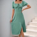 Detail of Swiss dot fabric and white lace trim on a sage green dress neckline - S / Green
