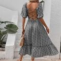 Floral backless summer dress with puff sleeves and tie-up design in black and white pattern - S / Black