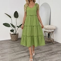 Detail of green cotton linen dress featuring bow straps and a tiered ruffle skirt design - S / Green