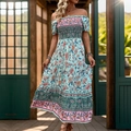 Blauwe bohemian maxi-jurk met bloemenprint, blote schouders en gesmokt lijfje - S / Groen