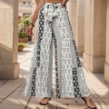 High waist wide leg pants with ethnic geometric print and tiered floral design in cream - S / Black