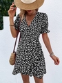 Slim fit black V-neck wrap dress with white daisy floral pattern and ruffle hem - S / Black