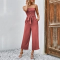 Sleeveless strapless wide leg jumpsuit in rust red with button detail and belted waist - S / Redwood