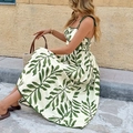 Sommerliches Trägerkleid in Weiß mit grünem Tropenprint und Schleifenträgern - S / Grün