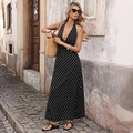 Summer halter neck maxi dress with white polka dots on black fabric and deep V-neck - Black