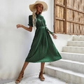 Dark green polka dot pleated dress with short puff sleeves and a waist tie belt - S / Green