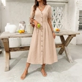 Detail of V-neck beige cotton linen dress with wood buttons and lace-up sleeves for summer - Apricot