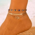 Gold anklet set with blue evil eye beads, chevron chain, and hamsa hand charm on ankle - KC Gold Tone Multi-Layer Leaf & Hand of Fatima Pendant