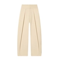 Detail of high-waist cream pleated balloon trousers with elegant drape texture - XS / Apricot