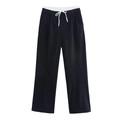Dettaglio dei pantaloni neri a gamba larga con vita a contrasto e coulisse bianca - XS / Nero