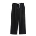 Dettaglio dei pantaloni a gamba larga con coulisse a contrasto e trama di alta qualità - XS / Nero