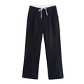 Dettaglio dei pantaloni neri a gamba larga da donna con coulisse elastica bianca a contrasto - XS / Acqua