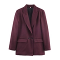 Detailed view of burgundy blazer with notch lapels, flap pockets and classic black buttons - Dark Red