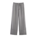 Detailed view of grey linen wide-leg trousers with adjustable drawstring elastic waist - XS / Gray Pants