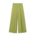 Dettaglio dei pantaloni larghi in lino verde erba con vita elastica e coulisse regolabile - XS / Verde