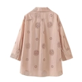 Detail of light pink long sleeve shirt featuring intricate eyelet floral embroidery and back pleat - XS / Tops / Lotus root pink