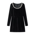 Detail of elegant rhinestone leaf embellishments on a black velvet dress neckline - Velvet Black