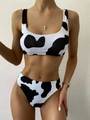 Detailed close-up of cow print bikini set with high waist bottom and sporty top - L / Black and White Cow