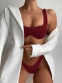 Detail of burgundy ribbed bikini set styled under a chic white blazer on model - S / Burgundy