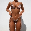 Detailed view of leopard print bikini set featuring triangle cups and side tie bottoms - S / Leopard Print