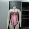 Slim fit one-piece swimsuit featuring red and white chevron stripes and thin straps - M / Red and White Striped