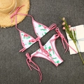 Detailed flat lay of a floral bikini set with red gingham ties and rose pattern print - S / White
