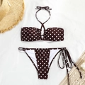 Flat lay of a brown polka dot bikini with bandeau top and side-tie bottoms on a white fabric - S / Coffee with White Polka Dots