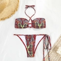 Flat lay of paisley bikini set with halter top and side-tie bottoms on a vacation background - S / Top And Bottom / Red Floral