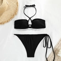 Flat lay of black halter bikini set with lace-up detail and straw beach accessories - S / Black
