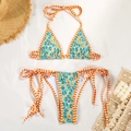 Flat lay of floral bikini set with blue pattern and orange straps on resort background - S / Lake Blue Floral