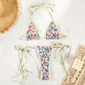 Flat lay of a vibrant floral bikini set with striped ties on a beach-themed background - S / Bright Yellow Floral