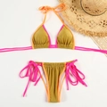 Flat lay of metallic gold bikini with pink trim, summer hat and lace details - S / Metallic Color Block