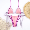 Detailed flat lay of pink and purple color-block bikini with side-tie bottoms and beach props - S / Pink and Purple Colorblock