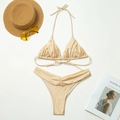 Flat lay of champagne gold bikini set with textured fabric on beach resort background - Champagne / S