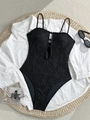 Detail of black one-piece swimsuit with crochet palm leaf patterns and button accents - S / Black