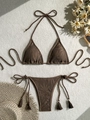 Detail of dark brown crochet bikini with woven rope ties and tassel accents on fabric - S / Brown