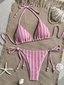Pink and white striped knit bikini set with gold beads on a rustic beach mat - Pink