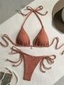 Detail of rust red waffle texture bikini set with shell charm and gold accents - S / Brick Red